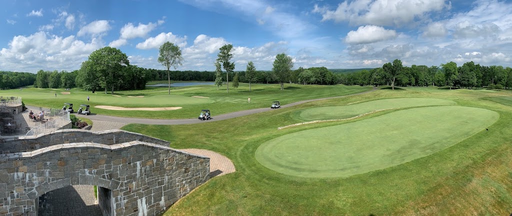 Panoramic view of a lush green golf course at Fairview Farm Golf Course. Smooth