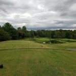 green grass with the flag in the hole.