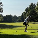 Panoramic view of a lush green golf course at Fairway Hills Golf Club. Smooth
