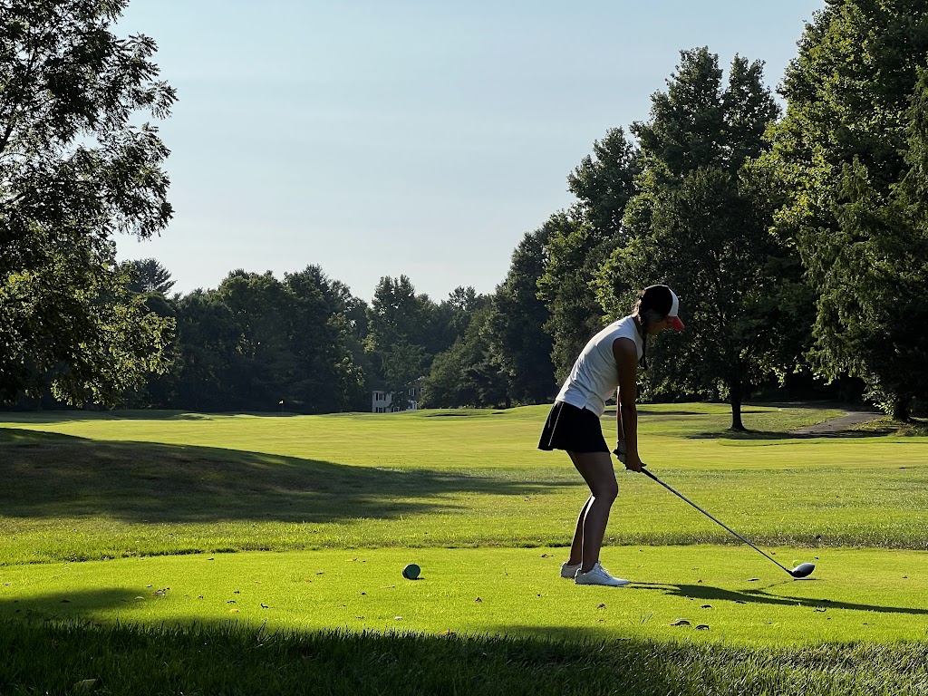 Panoramic view of a lush green golf course at Fairway Hills Golf Club. Smooth