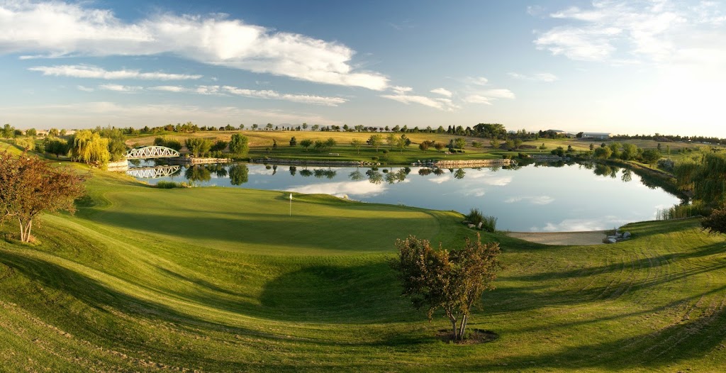 Panoramic view of a lush green golf course at Falcon Crest Golf Club. Smooth