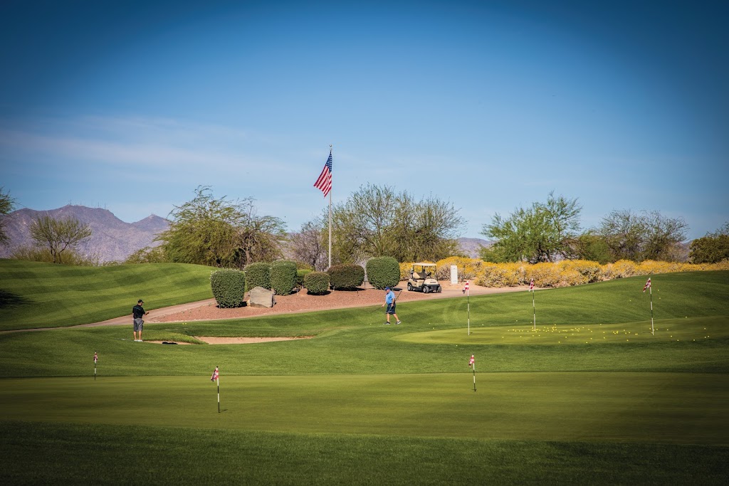 Panoramic view of a lush green golf course at Falcon Dunes Golf Course. Smooth