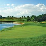 Panoramic view of a lush green golf course at Falcon Lakes Golf Club. Smooth