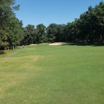 Panoramic view of a lush green golf course at Fall Creek Falls Golf Course (TN Golf Trail). Smooth