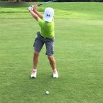 green grass with the flag in the hole.