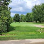 Panoramic view of a lush green golf course at Far Vu Golf Course. Smooth