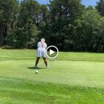 green grass with the flag in the hole.