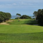 Panoramic view of a lush green golf course at Farm Neck Golf Club. Smooth