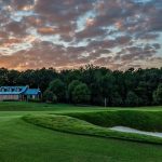 Panoramic view of a lush green golf course at FarmLinks at Pursell Farms. Smooth