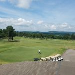 Panoramic view of a lush green golf course at Fayetteville Country Club. Smooth
