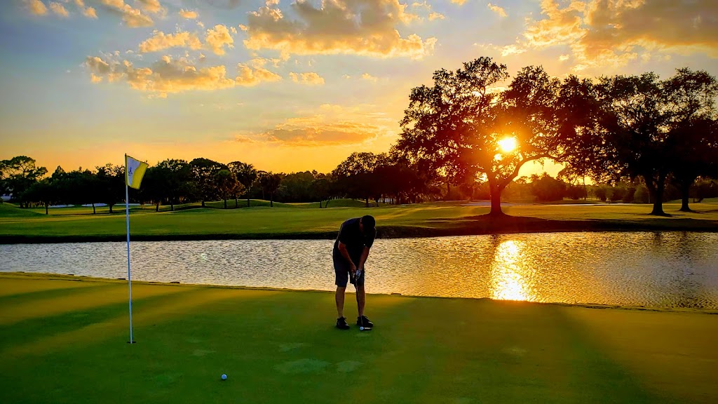 Panoramic view of a lush green golf course at Feather Sound Country Club. Smooth