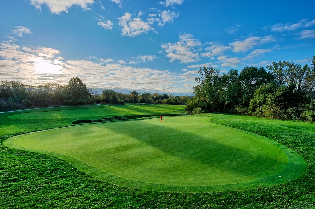 Panoramic view of a lush green golf course at Firekeeper Golf Course. Smooth