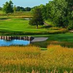 Panoramic view of a lush green golf course at Firethorn Golf Club. Smooth