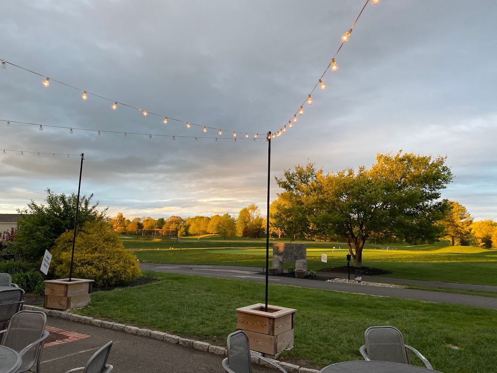 Panoramic view of a lush green golf course at Five Ponds Golf Club. Smooth