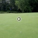 green grass with the flag in the hole.