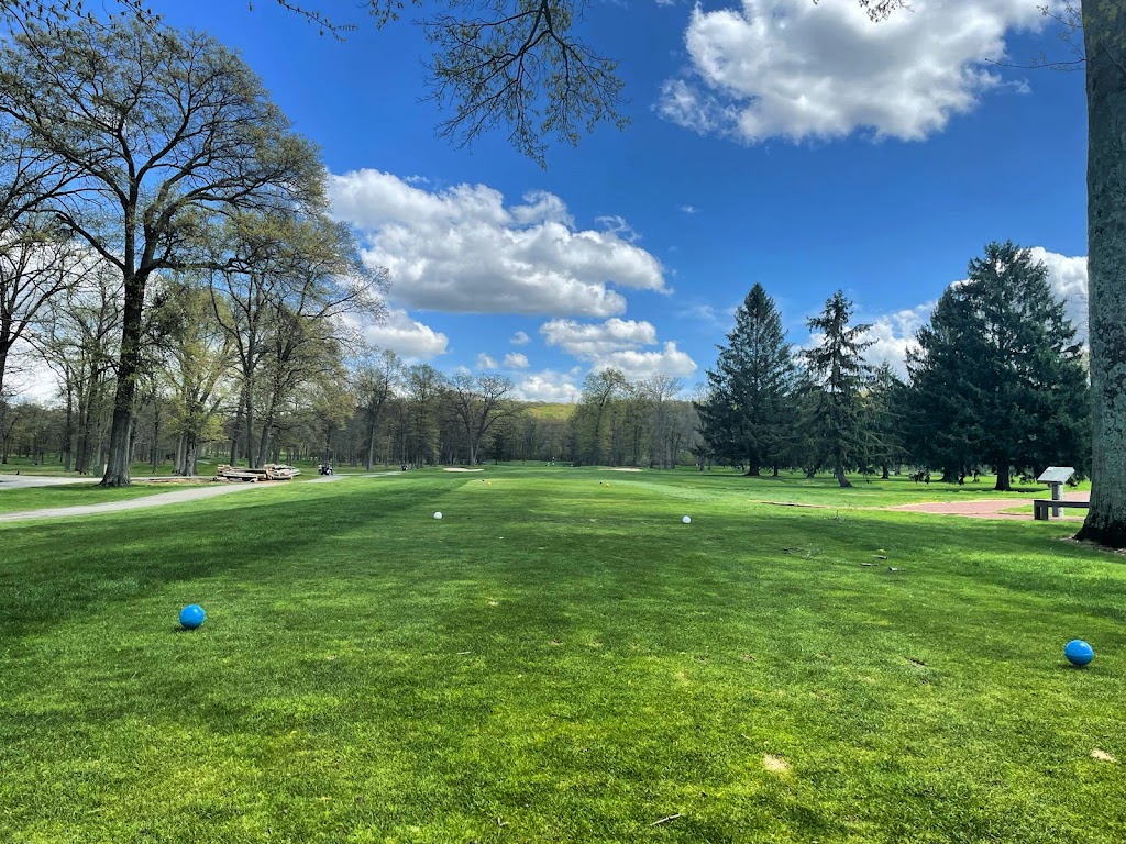 Panoramic view of a lush green golf course at Flanders Valley Golf Course. Smooth