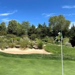 Panoramic view of a lush green golf course at Flint Hills National Golf Club. Smooth