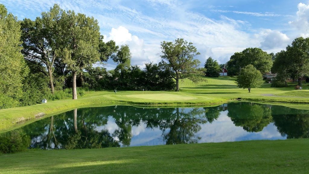 Panoramic view of a lush green golf course at Florissant Golf Club. Smooth
