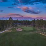 Panoramic view of a lush green golf course at Flying Horse North Golf Course. Smooth