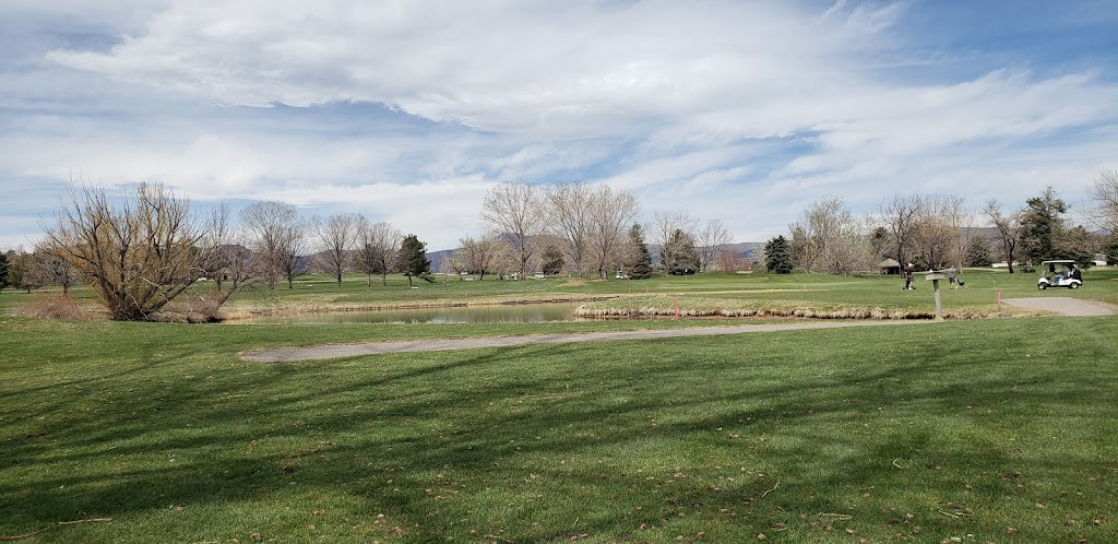 Panoramic view of a lush green golf course at Foothills Golf Course. Smooth