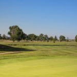 Panoramic view of a lush green golf course at Forbes Golf Course. Smooth