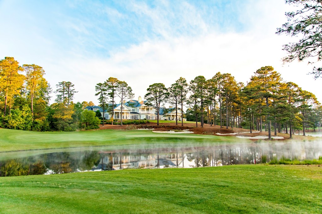 Panoramic view of a lush green golf course at Forest Creek Golf Club. Smooth
