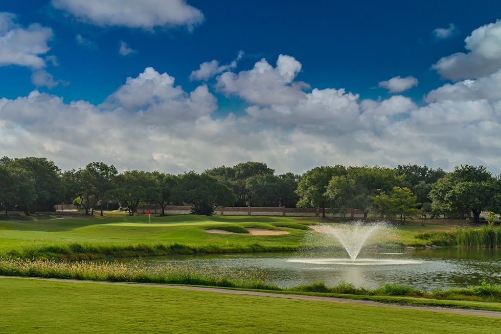 Panoramic view of a lush green golf course at Forest Creek Golf Club. Smooth