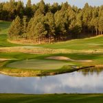 Panoramic view of a lush green golf course at Forest Highlands Golf Club. Smooth