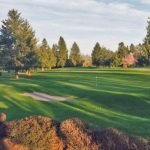 Panoramic view of a lush green golf course at Forest Hills Golf Course. Smooth