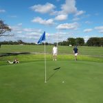 Panoramic view of a lush green golf course at Fort Hays Municipal Golf Course. Smooth