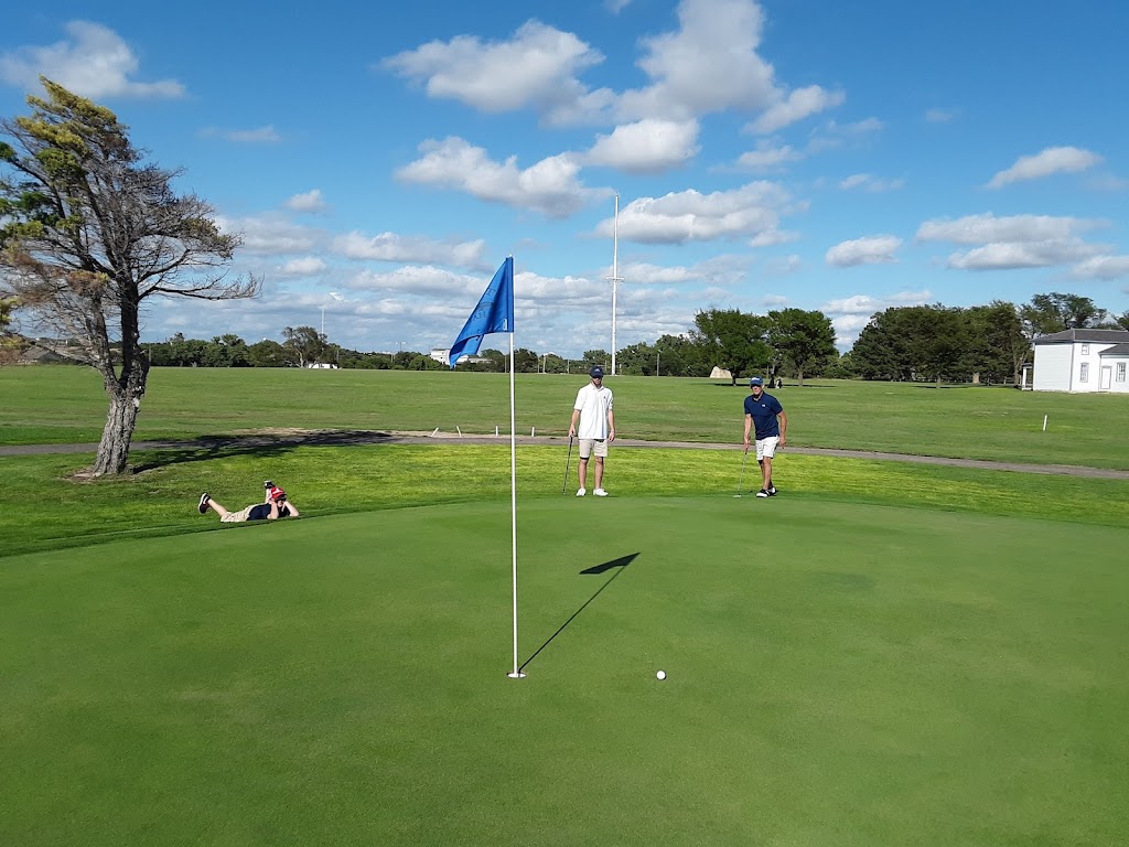 Panoramic view of a lush green golf course at Fort Hays Municipal Golf Course. Smooth