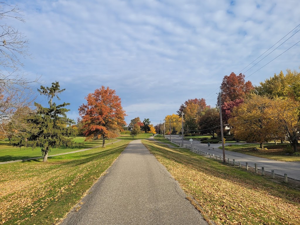 Panoramic view of a lush green golf course at Foster Park Golf Course. Smooth