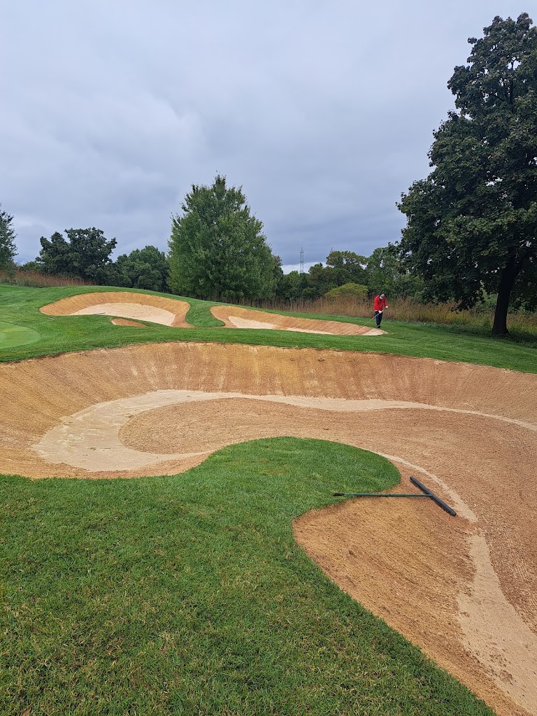 Panoramic view of a lush green golf course at Four Streams