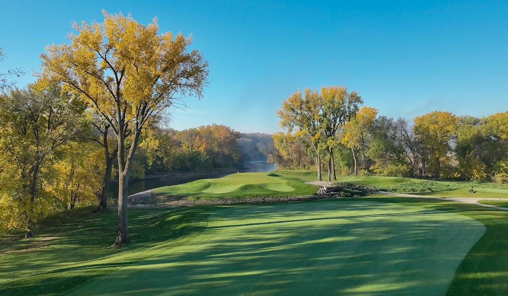 Panoramic view of a lush green golf course at Fox Hollow Golf Club. Smooth