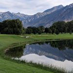 Panoramic view of a lush green golf course at Fox Hollow Golf Club. Smooth