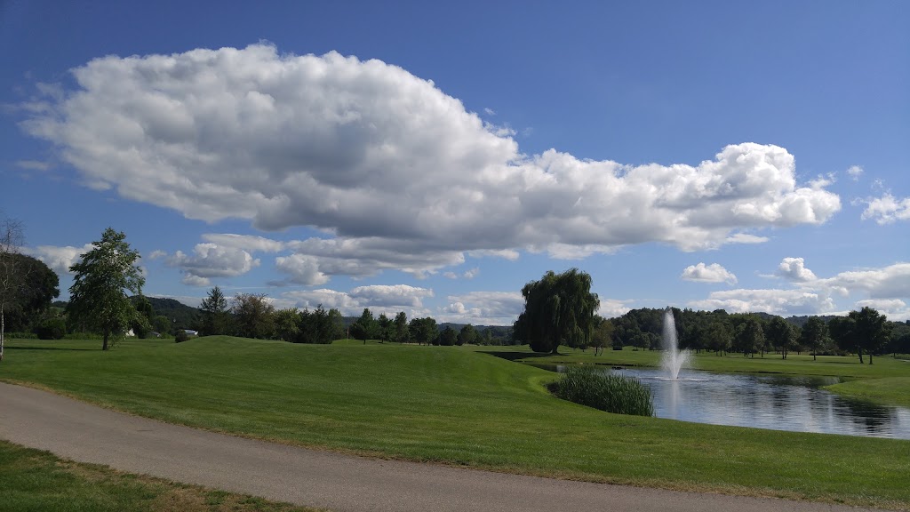 Panoramic view of a lush green golf course at Fox Hollow Golf Course. Smooth