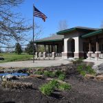Panoramic view of a lush green golf course at Fox Prairie Golf Course. Smooth