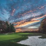 Panoramic view of a lush green golf course at Foxborough Country Club. Smooth