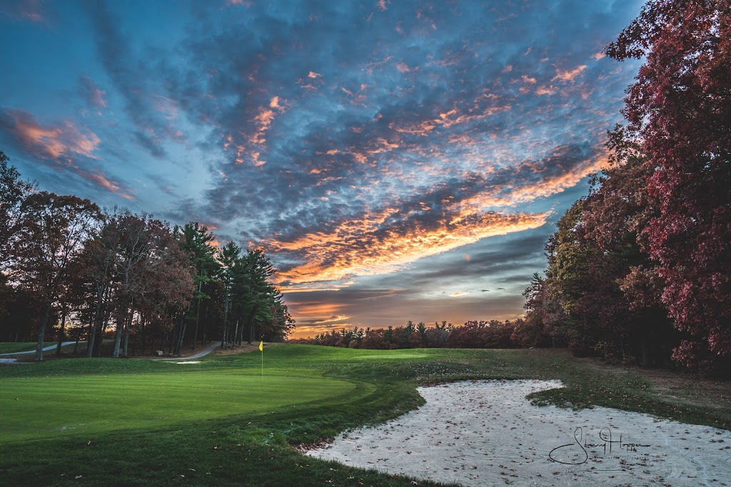 Panoramic view of a lush green golf course at Foxborough Country Club. Smooth