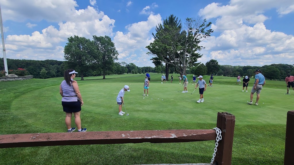 Panoramic view of a lush green golf course at Franconia Golf Course. Smooth