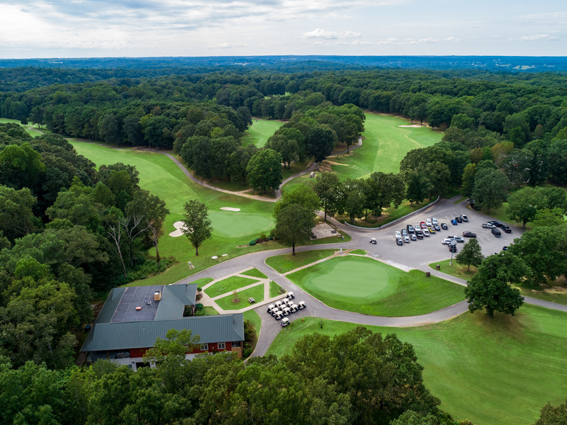 Panoramic view of a lush green golf course at Frank G. Clement Golf Course. Smooth