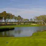 Panoramic view of a lush green golf course at Frederica Golf Club. Smooth