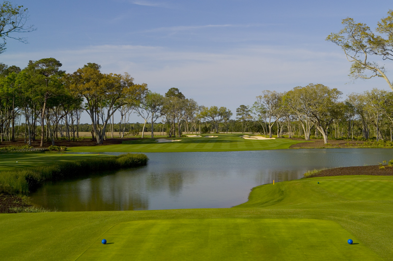 Panoramic view of a lush green golf course at Frederica Golf Club. Smooth