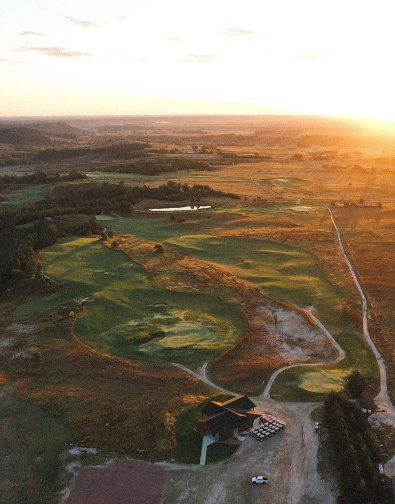 Panoramic view of a lush green golf course at Frederick Peak Golf Club. Smooth