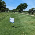 Panoramic view of a lush green golf course at Fremont Golf Club. Smooth