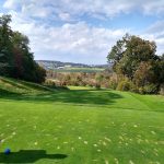 Panoramic view of a lush green golf course at French Creek Golf Club. Smooth
