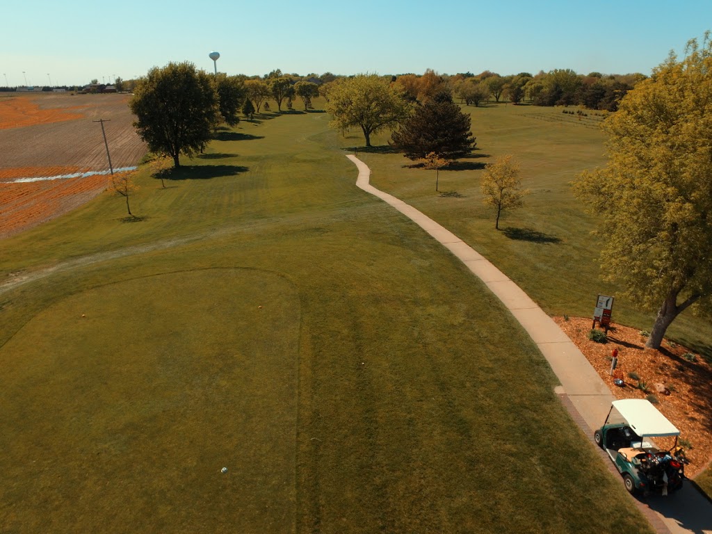 Panoramic view of a lush green golf course at Friend Country Club. Smooth
