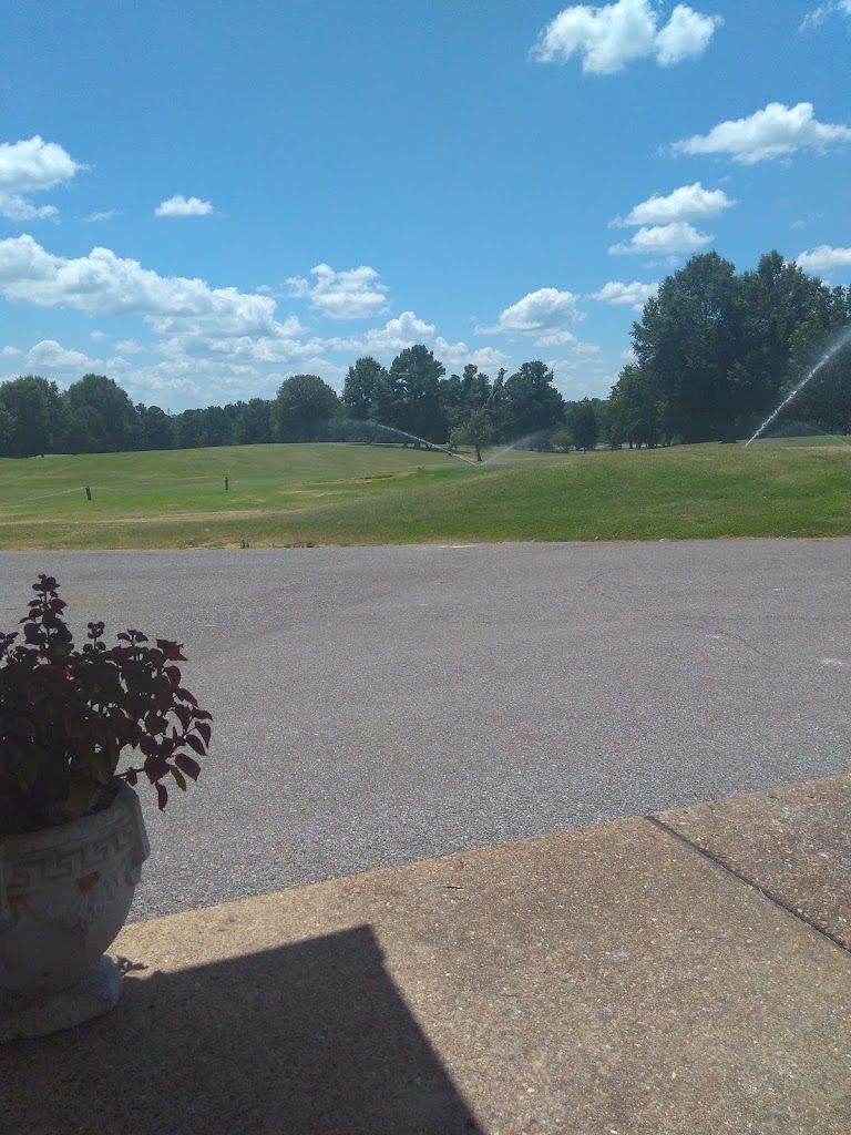 Panoramic view of a lush green golf course at Fulton Country Club. Smooth