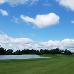 Panoramic view of a lush green golf course at Furnace Bay Golf Course. Smooth