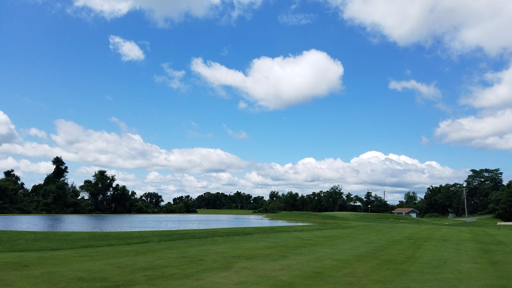 Panoramic view of a lush green golf course at Furnace Bay Golf Course. Smooth